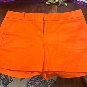 Orange J. Crew shorts.
